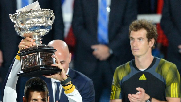 Novak Djokovic hold up the trophy after his victory over Andy Murray at the 2013 Australian Open final