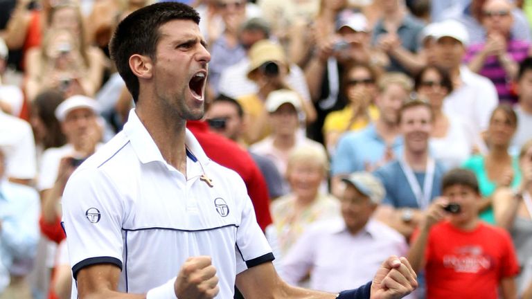 Novak Djokovic reacts after he won his match against Roger Federer during Day Thirteen of the 2011 US Open