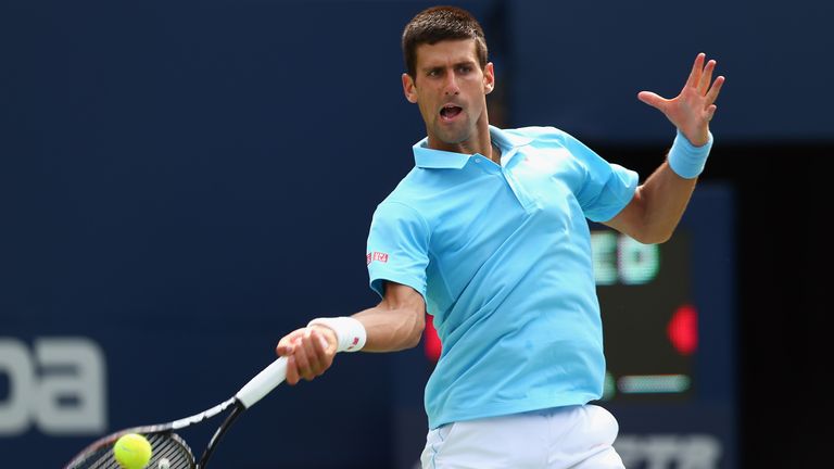 Novak Djokovic returns a shot at the Rogers Cup