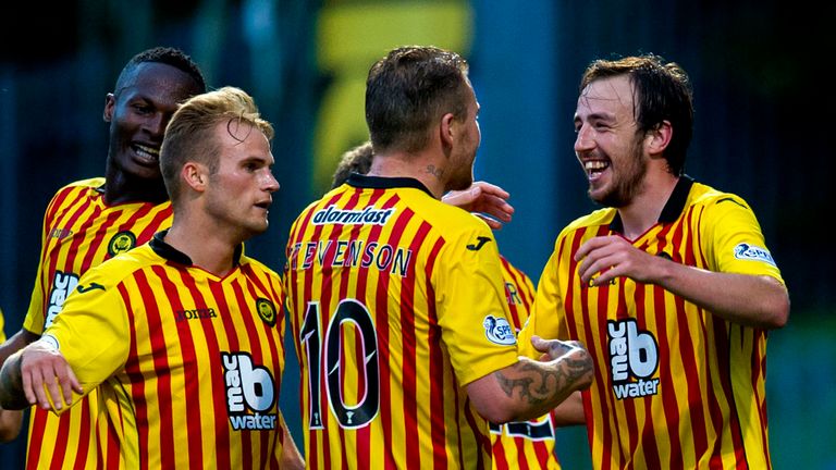 Partick's Stuart Bannigan celebrates his opener with team-mates Kallum Higginbotham and Ryan Stevenson against Ross County in the Scottish Premiership