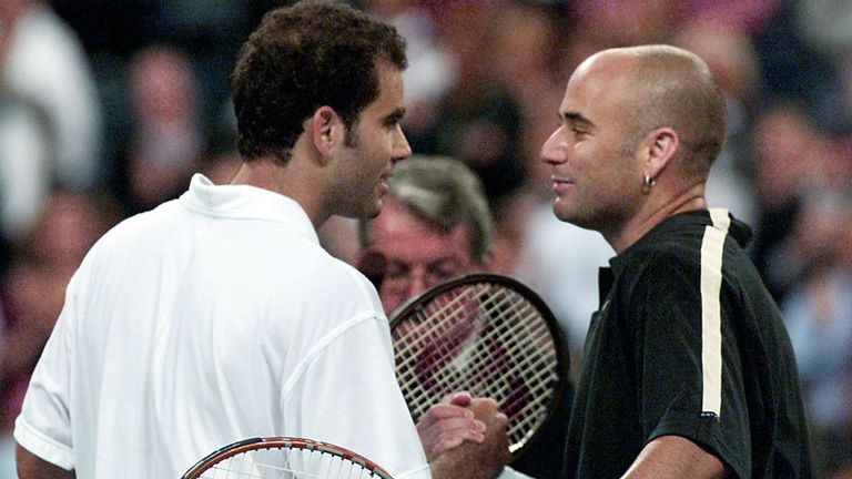 Pete Sampras (L) of the US and number two seeded Andre Agassi (R) of the US shake hands at the net at the end of their match 05 September, 2001