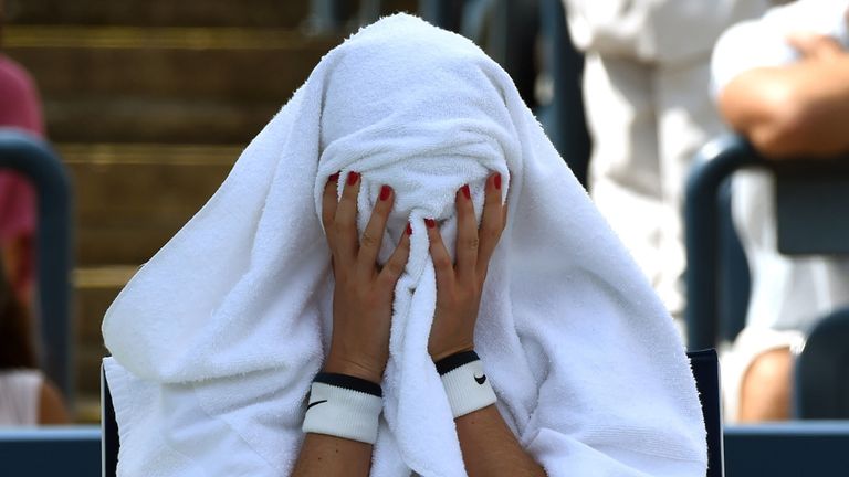 Petra Kvitova of the Czech Republic sits on the sideline during a break in her match against Aleksandra Krunic