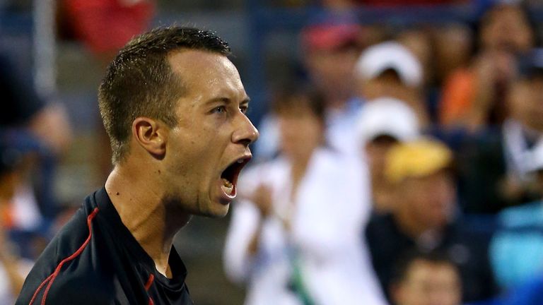NEW YORK, NY - AUGUST 30:  Philipp Kohlschreiber of Germany celebrates after defeating John Isner of the United States in their men's singles third round m
