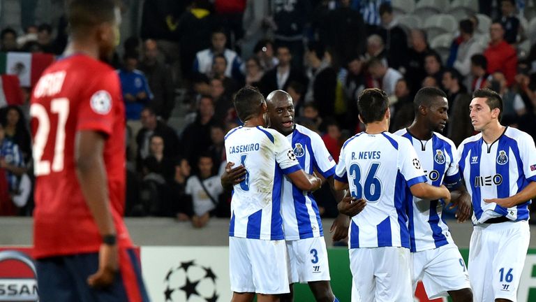 Porto's players celebrate at the end of the UEFA Champions League play-off first leg football match between Lille and Porto