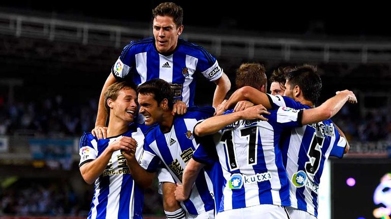 SAN SEBASTIAN, SPAIN - AUGUST 31:  David Zurutuza Veillet (2ndR) of Real Sociedad celebrates with his teammates  after scoring his team's third goal during