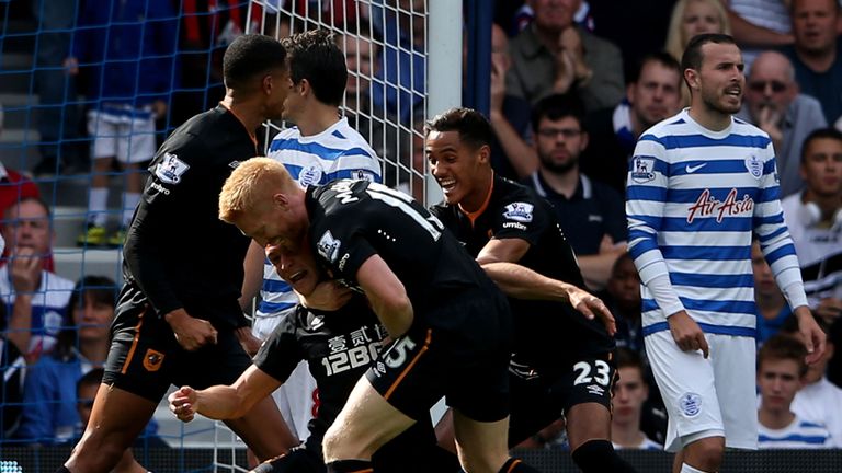 James Chester #5 of Hull City is congratulated by teammates after scoring the opening goal during the Barclays Premier League match between QPR and Hull