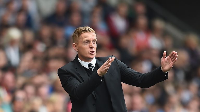 Sweansea manager Garry Monk gives directions to his players