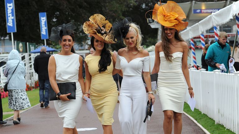 Racegoers arrive for Ladies Day during Day Two of the 2014 Welcome To Yorkshire Ebor Festival at York 