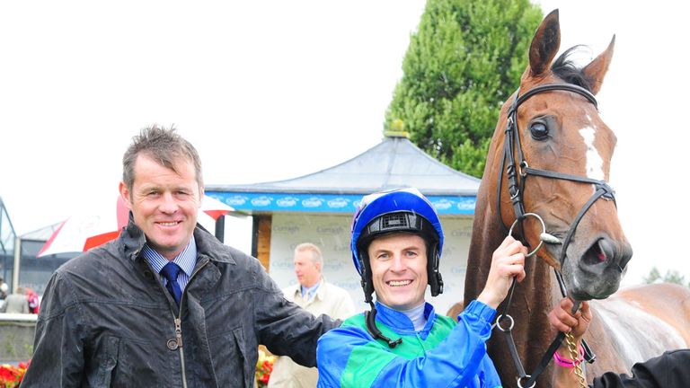 Jockey Fran Berry and trainer Andy Oliver with Run The Red Light after winning the Loder EBF Fillies Race at Curragh Racecourse, County Kildare.