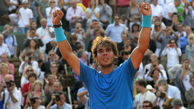 Rafael Nadal reacts after winning over Roger Federer during their men's final in the 2011 French Open final at Roland Garros