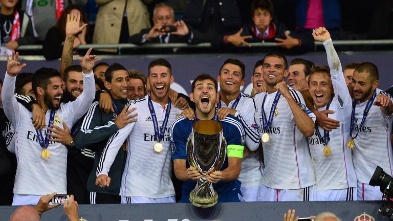 Real Madrid's goalkeeper Iker Casillas lifts the UEFA Super Cup trophy 