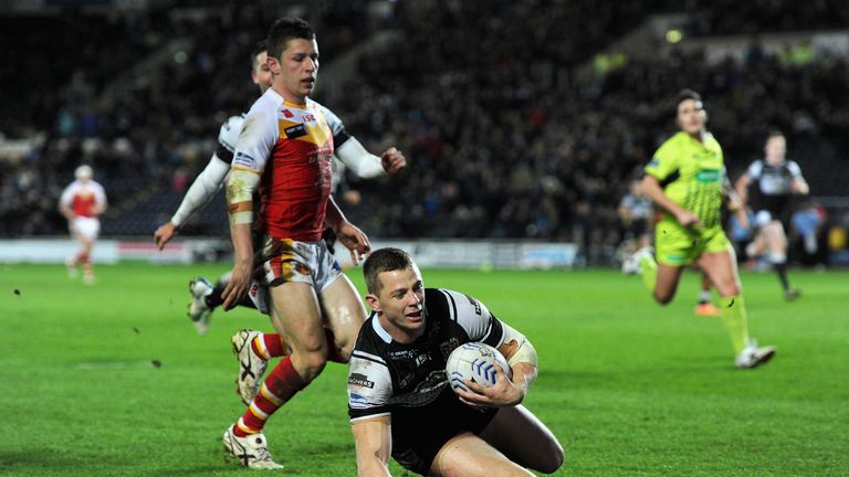 Richard Horne of Hull FC scores a try in a Super League match