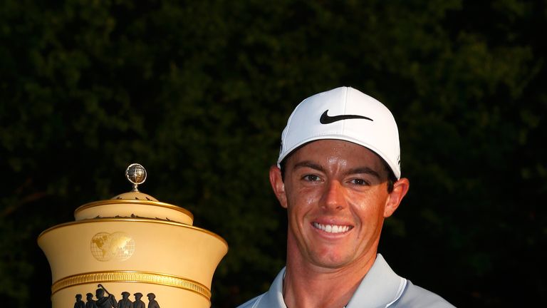 Rory McIlroy of Northern Ireland holds the Gary Player Cup trophy after winning the World Golf Championships-Bridgestone Invitationa