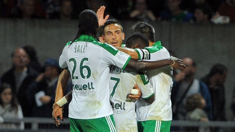Saint-Etienne's French Turkish forward Mevlut Erding (3rdR) is congratulated after scoring a goal