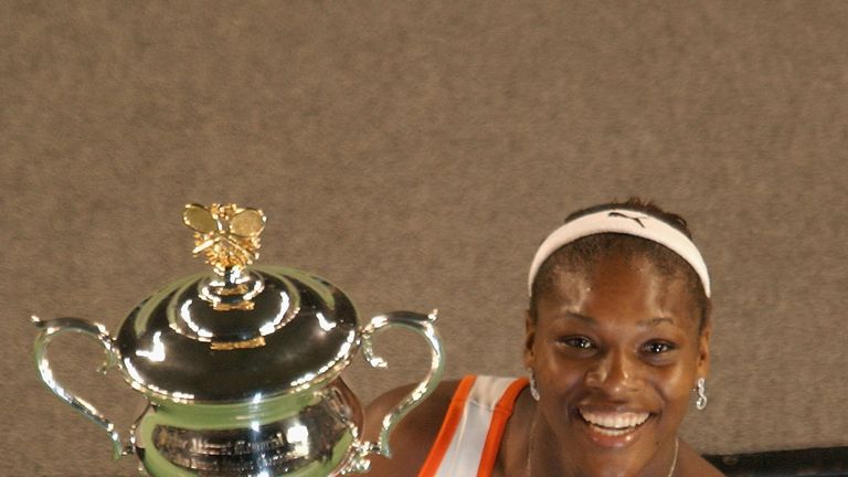 Serena Williams of the USA holds the winners trophy after defeating her sister Venus Williams in the 2003 Australian Open final