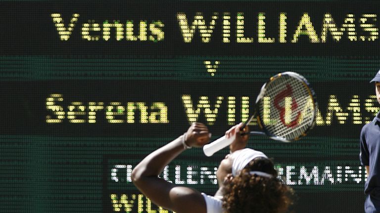 Serena Williams celebrates after beating Venus Williams to win the 2009 Wimbledon women's title  