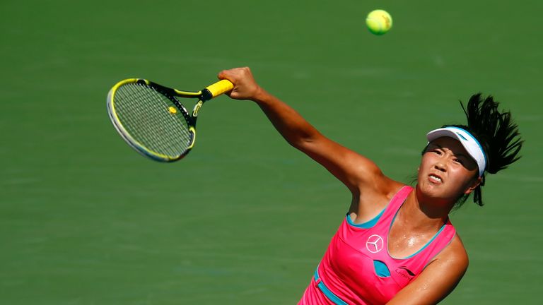Shuai Peng of China returns a shot to Agnieszka Radwanska at the US Open