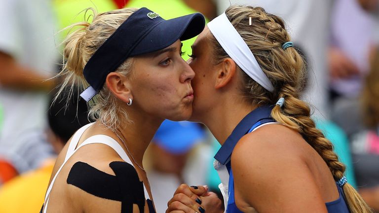 NEW YORK, NY - AUGUST 30:  Victoria Azarenka (R) of Belarus kisses Elena Vesnina (L) of Russia after their third round match on Day Six of the 2014 US Open
