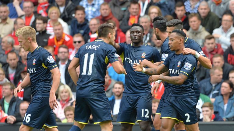 Southampton's English defender Nathaniel Clyne (R) clebrates scoring the equalising goal with teammates during the English Premier League football match be