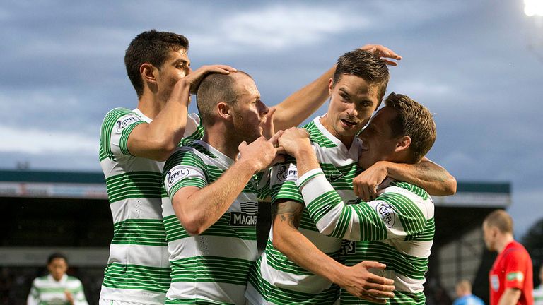 Anthony Stokes celebrates with Celtic team-mates Nir Biton Mikael Lustig and Kris Commons after opening the scoring against St Johnstone