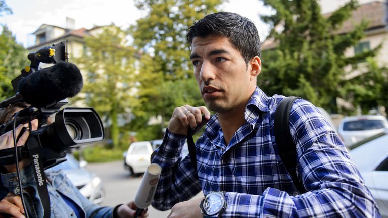 Barcelona's Uruguayan forward Luis Suarez who is currently serving a four-month suspension after his infamous World Cup bite of Italy's defender Giorgio Ch