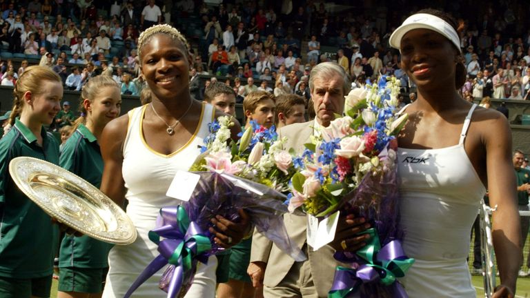 Serena Williams (L) and her sister Venus hold their trophy's after the 2002 Women's final at Wimbledon, which Serena won 7¿6 (7¿4) 6¿3