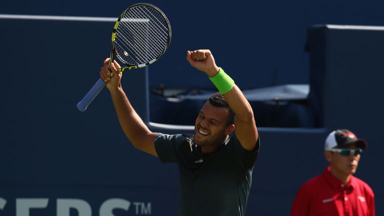 Jo-Wilfried Tsonga of France celebrates his swin against Grigor Dimitrov at the Rogers Cup
