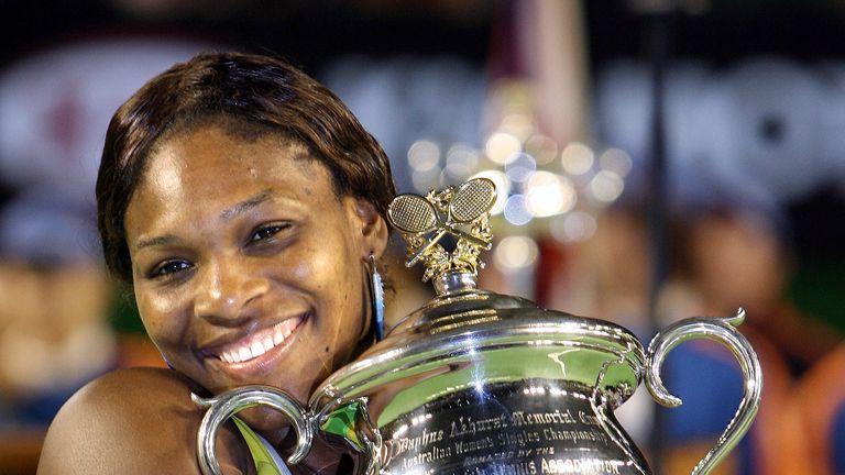 Serena Williams holds the winner's trophy following her victory over Maria Sharapova in the 2005 Australian Open final