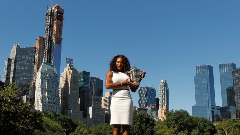 Serena Williams, the 2012 US Open Champion, poses with the trophy in Central Park