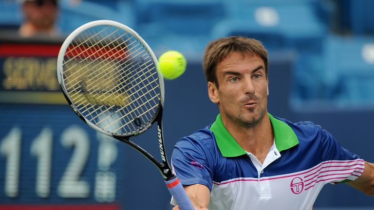 Tommy Robredo of Spain returns to Jack Sock during a match  at the Western & Southern Open in Cincinnati