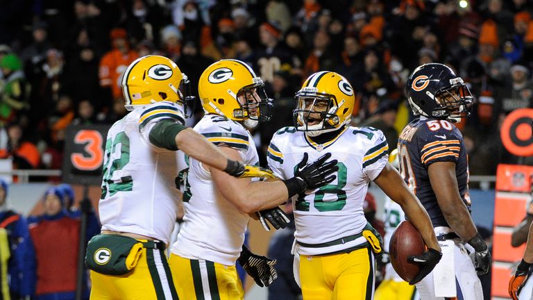 Randall Cobb (No 18) of the Green Bay Packers is greeted after scoring a touchdown