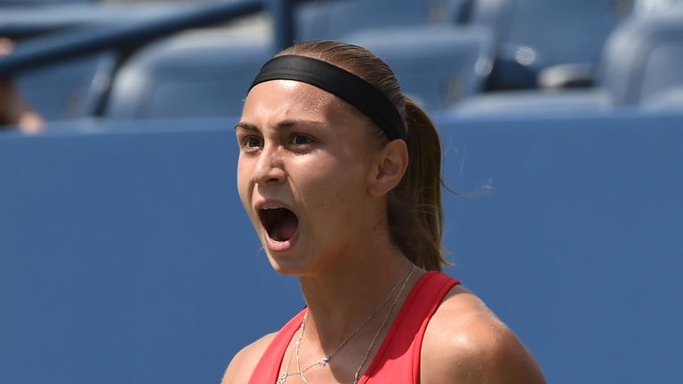 Aleksandra Krunic of Serbia celebrates a point against Petra Kvitova of the Czech Republic during their 2014 US Open women's singles match at the USTA Bill