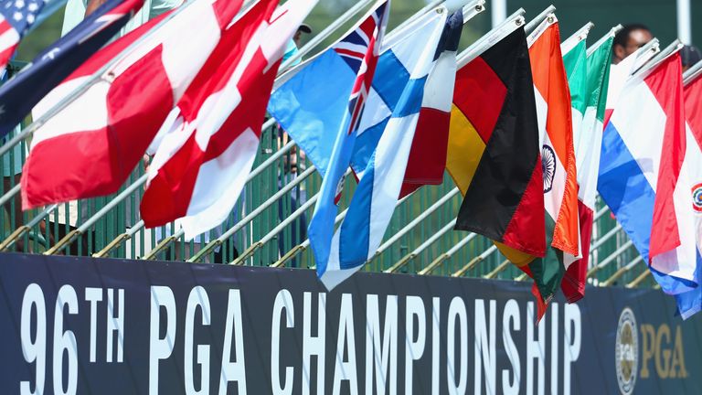 Flags fly above a PGA Championship sign during a practice round prior to the start of the 96th PGA Championship at Valhalla Golf