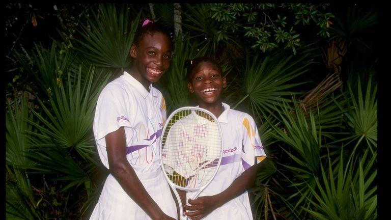 Venus Williams (left) stands with her sister and fellow tennis player Serena Williams