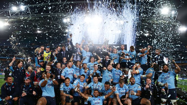 SYDNEY, AUSTRALIA - AUGUST 02:  Waratahs players celebrate victory and hold the Super Rugby trophy during the Super Rugby Grand Final match between the War