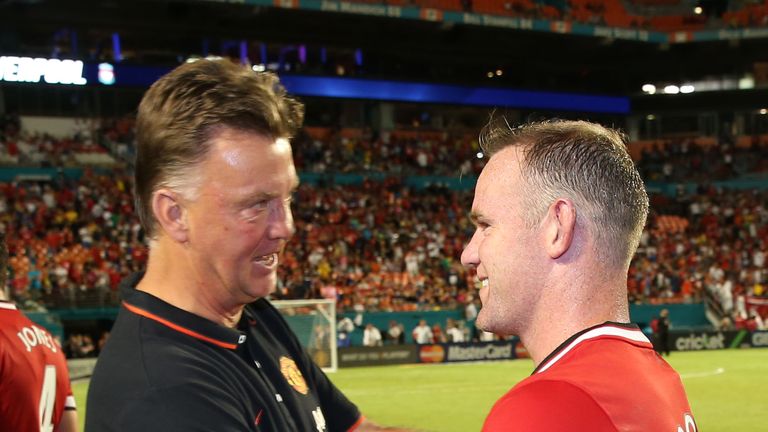 Louis van Gaal of Manchester United congratulates Wayne Rooney after the pre-season friendly match against Liverpool.