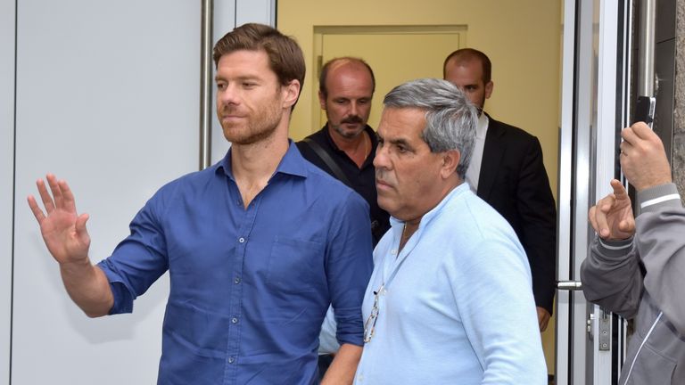 Xabi Alonso of Real Madrid leaves after a medical checkup at a sports physician in Munich