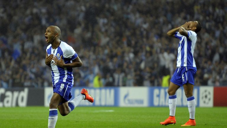 Porto's French-born Algerian midfielder Yacine Brahimi  (L) celebrates after scoring a goal during the UEFA Champions League play-off second leg football m