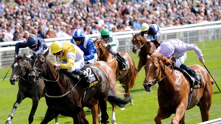 Dutch Connection ridden by William Buick (right) comes through to beat Tocoolforschool ridden by Ben Curtis to win the Tattersalls Acomb Stakes at York.