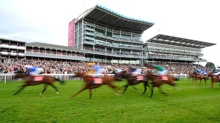 A general view as runners flash past the winning post at York