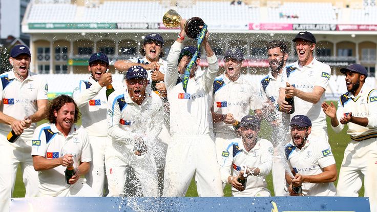 NOTTINGHAM, ENGLAND - SEPTEMBER 12:  Yorkshire celebrate with the County Championship Trophy after beating Notts to secure the league.