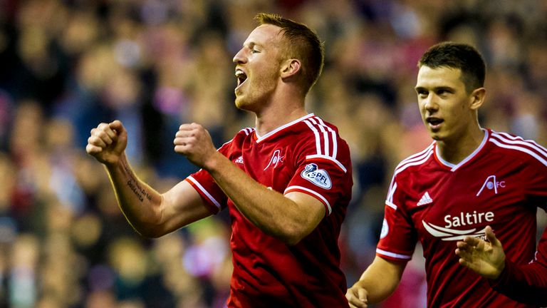 Aberdeen's Adam Rooney (left) celebrates with team-mates Ryan Jack and David Goodwillie (right)