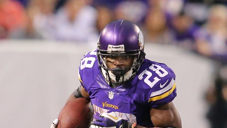 Adrian Peterson of the Minnesota Vikings carries the ball against Chicago Bears