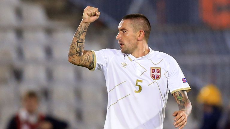 Aleksandar Kolarov of Serbia celebrates the scoring their goal against France