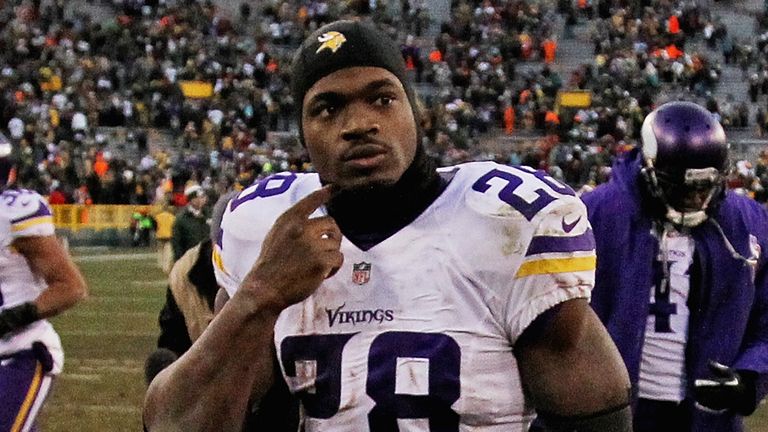 GREEN BAY, WI - NOVEMBER 24: Adrian Peterson #28 of the Minnesota Vikings walks off of the field after a tie against the Green Bay Packers.