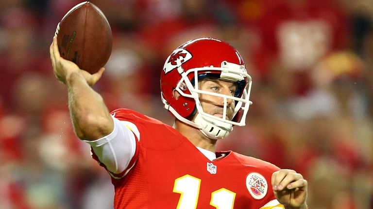 Alex Smith #11 of the Kansas City Chiefs passes against the New England Patriots during the first half at Arrowhead Stadium