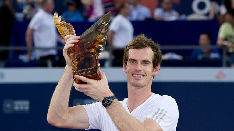 Andy Murray of Britain lifts his trophy after winning at the inaugural ATP Shenzhen Open