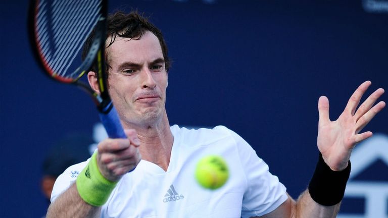 Andy Murray returns a shot against Juan Monaco during their semi-final at the 2014 Shenzhen Open 