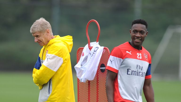 Arsene Wenger and Danny Welbeck of Arsenal during a training session at London Colney on September 11, 2014 in St Albans, England