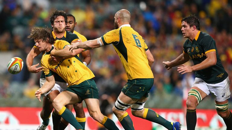 Rob Horne of Australia is tackled against South Africa